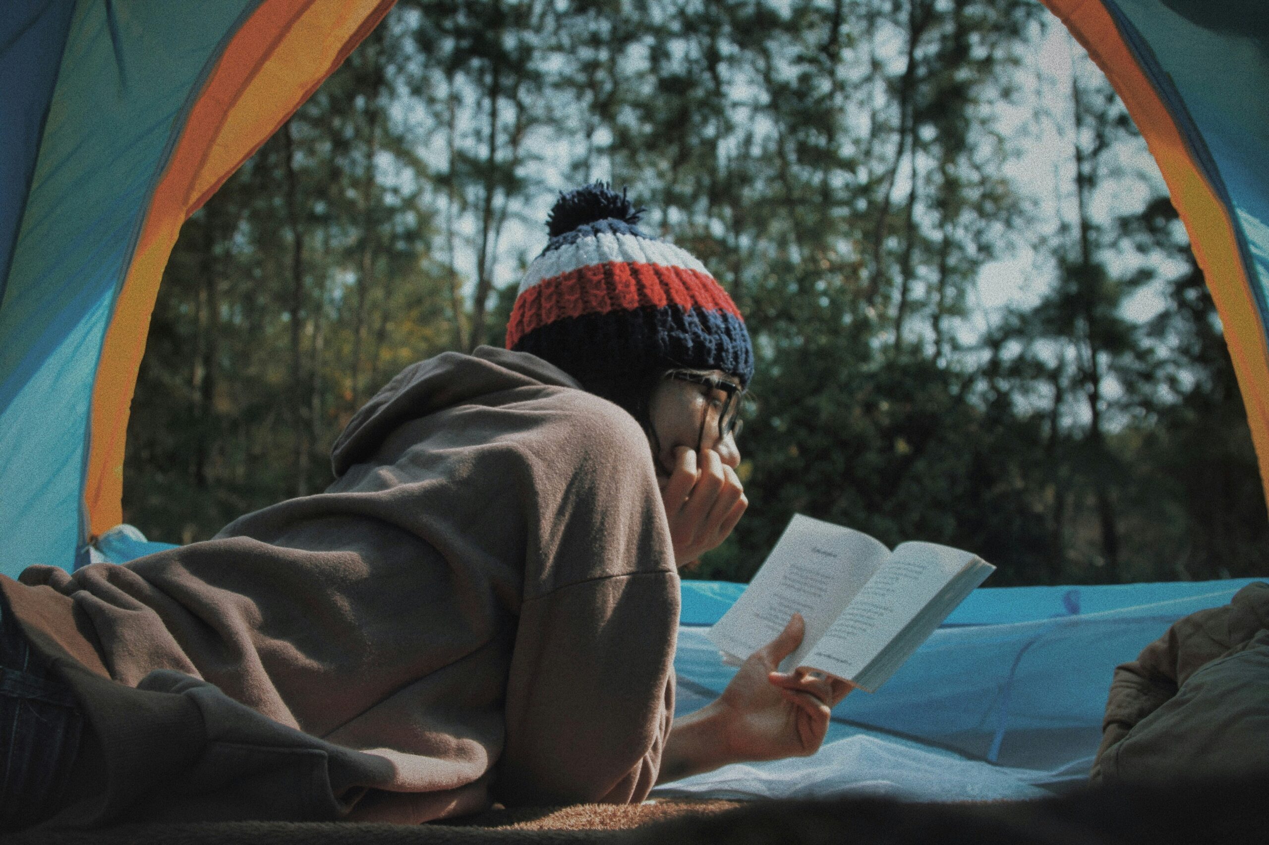 A person struggling to read a book, highlighting common reading difficulties faced by individuals with dyslexia.