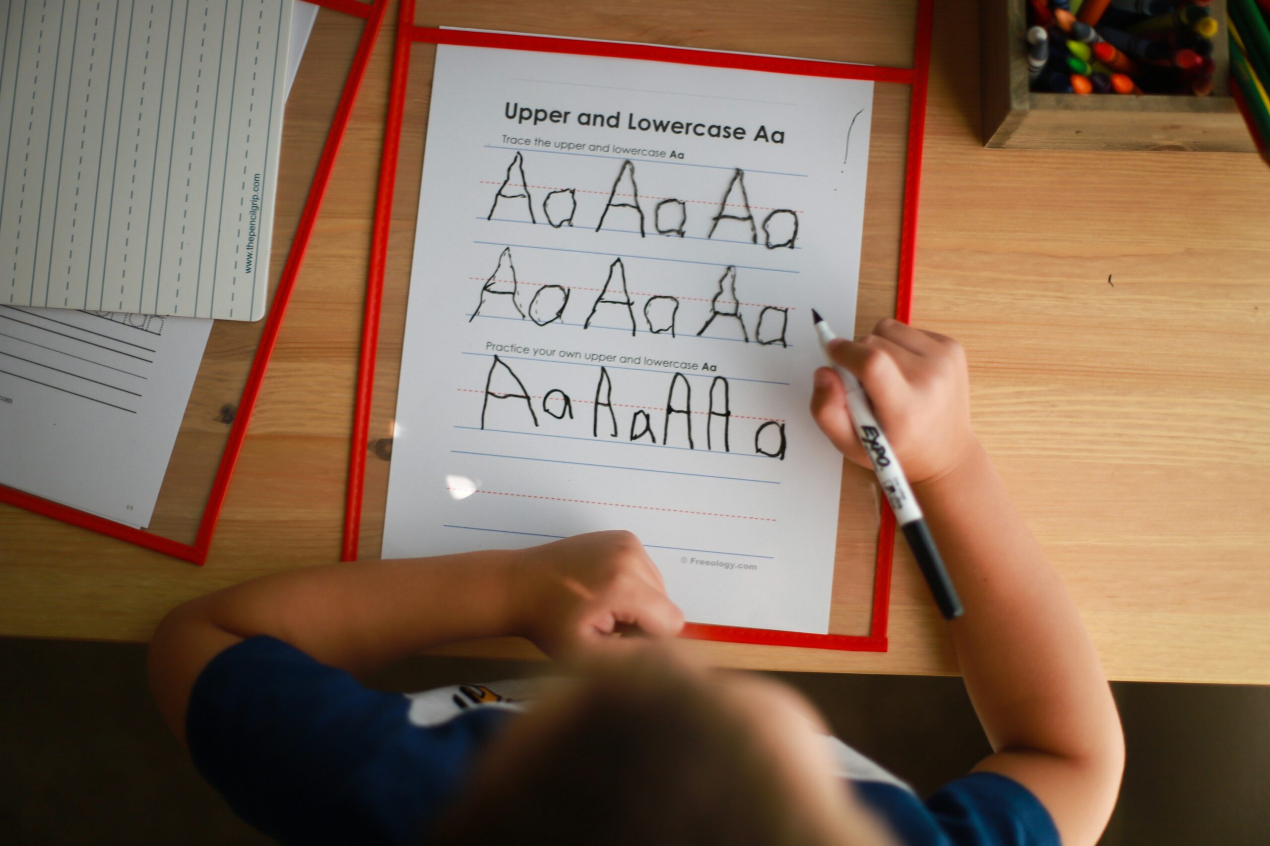 Smiling child holding a certificate after excelling in reading thanks to a dyslexia learning app