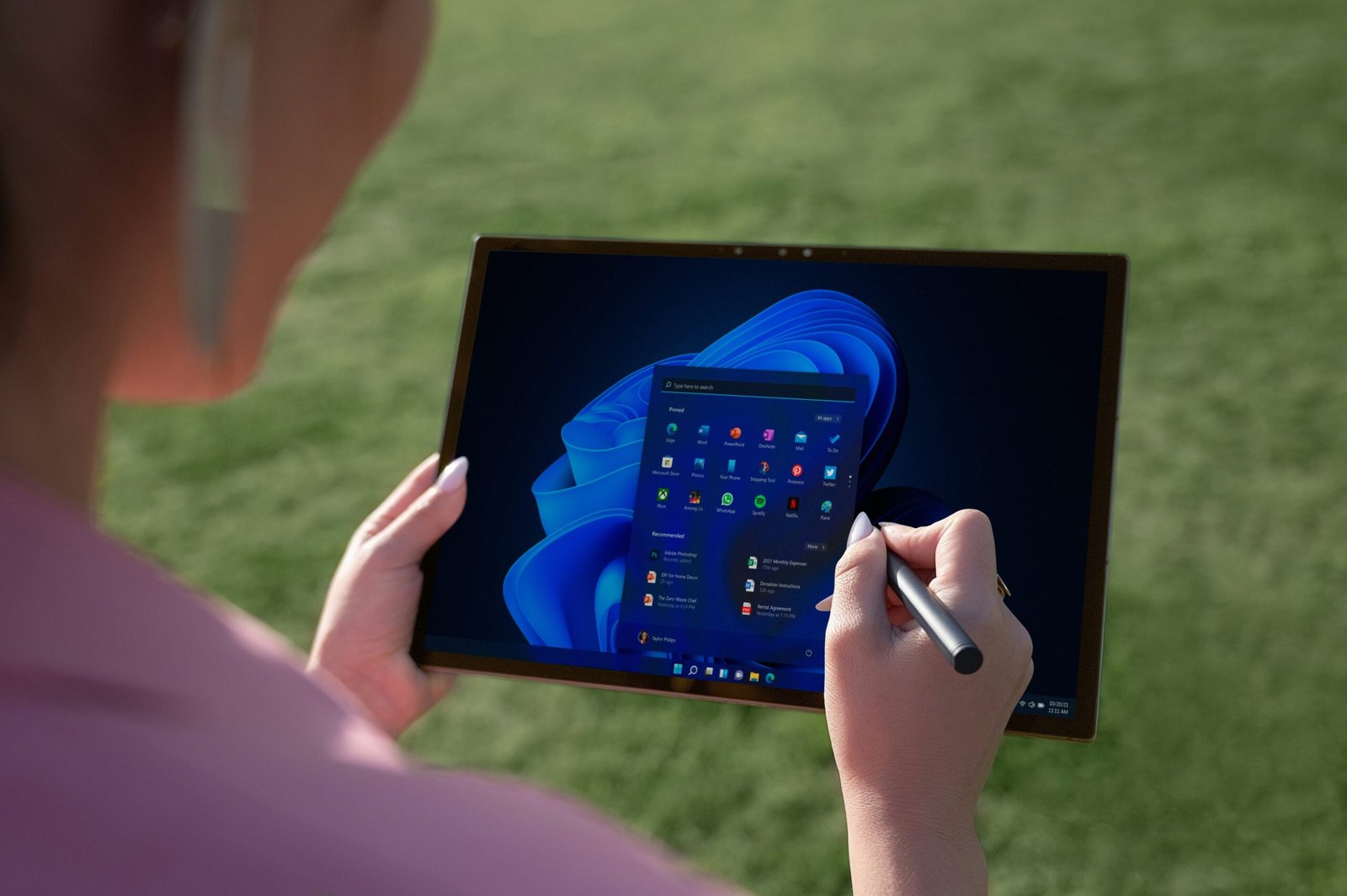 Photo of child smiling while using a learning support app on a tablet