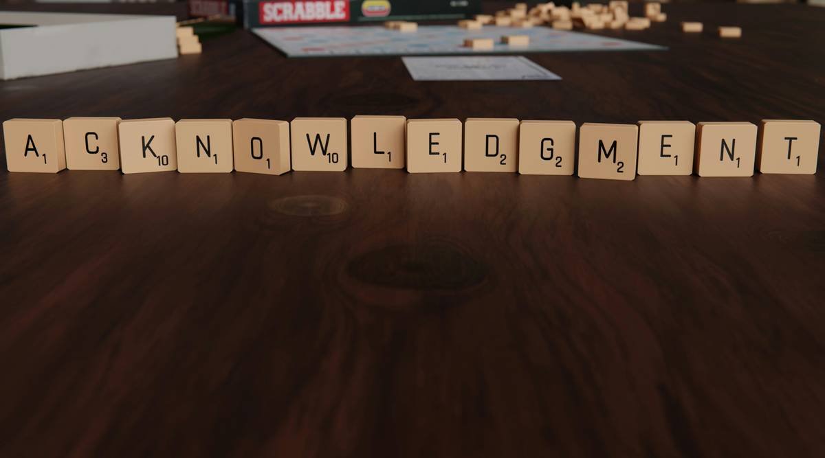 Image showing a young girl struggling to write words on paper due to dyslexia