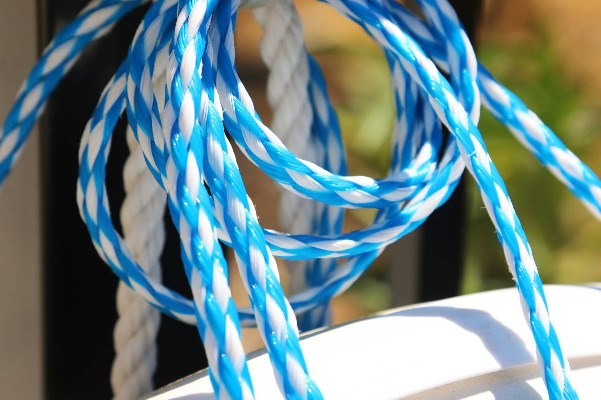 Blue and white ropes are coiled.