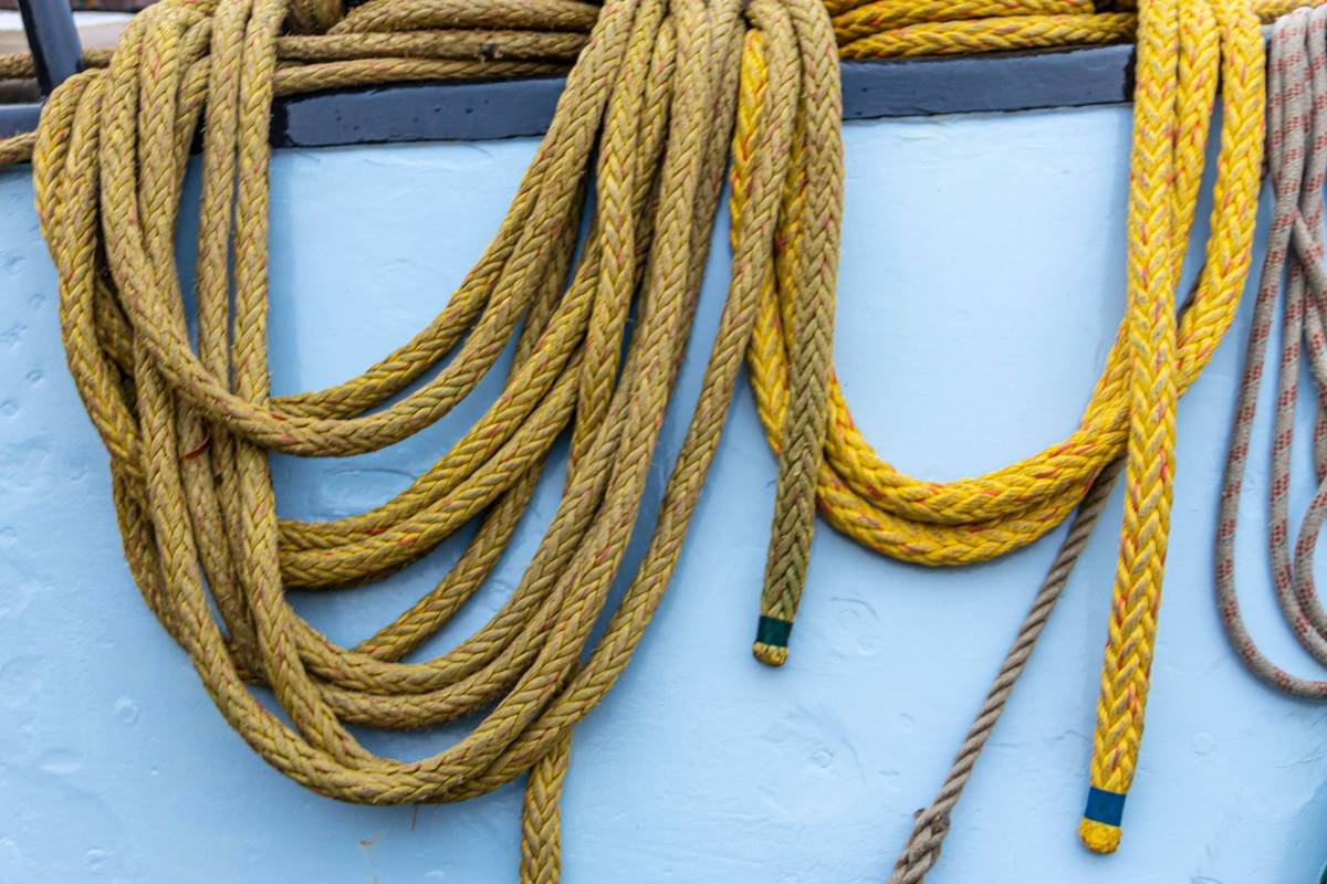 brown rope on white wooden surface