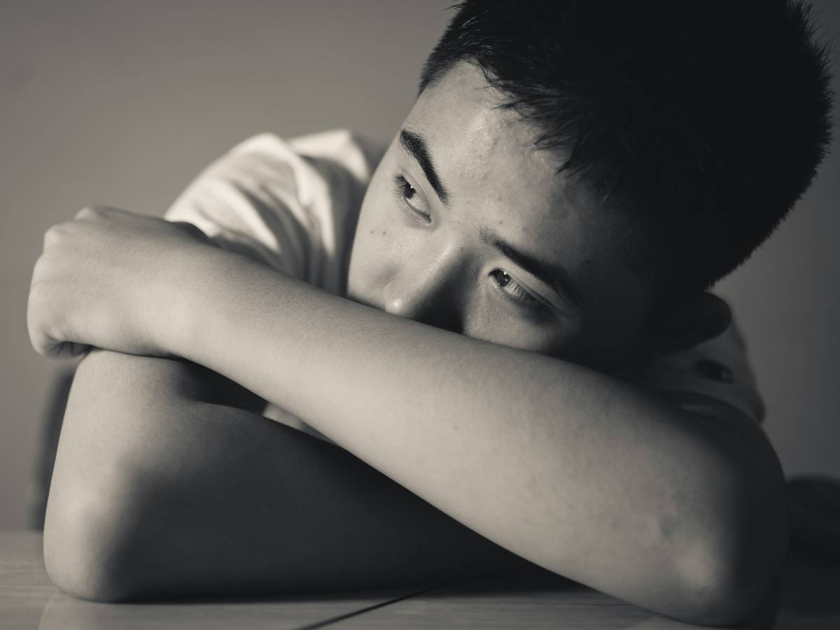 grayscale photo of man in t-shirt