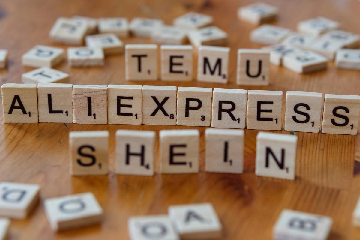 Scrabbled letters spelling out the word team, allexpress, she